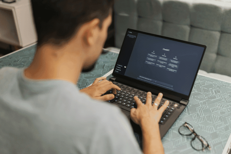Person using laptop with ChatGPT interface